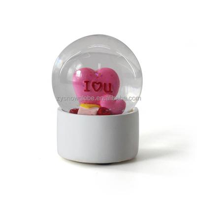 China Small Public Custom Plastic Snow Globe for sale