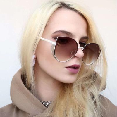 China Fashion sunglasses factory cheap wholesale ladies shape oversized sunglasses rimless sunglasses for sale