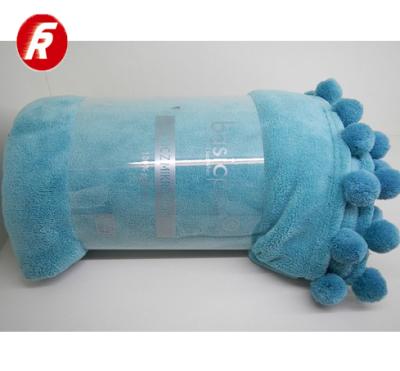 China Disposable Solid Coral Fleece Blanket With Pompom for sale