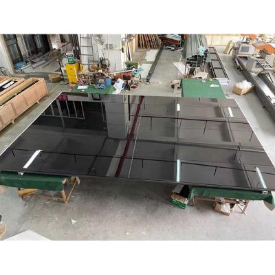 China Modern Aluminum Alloy Mirror Tempered Glass Reflective Black Garage Door Manufacturer for sale