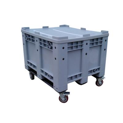 China HDPE Industry Single Faced Solid Stacking Plastic Pallet Box With Wheels for sale