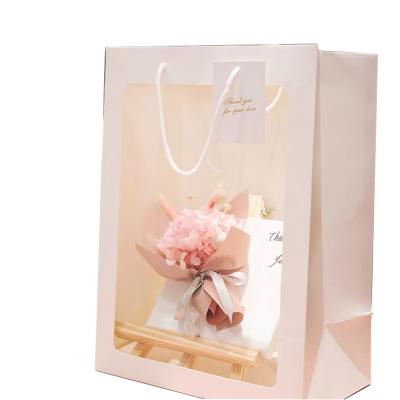 China Beautiful Recyclable Custom Christmas Gift Bags Shopping Bag Luxury Paper Bag With Clear Window for sale