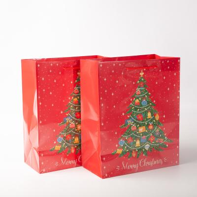 China Disposable Fine Quality Christmas Tree Customize Printed Shop Paper Bag for sale