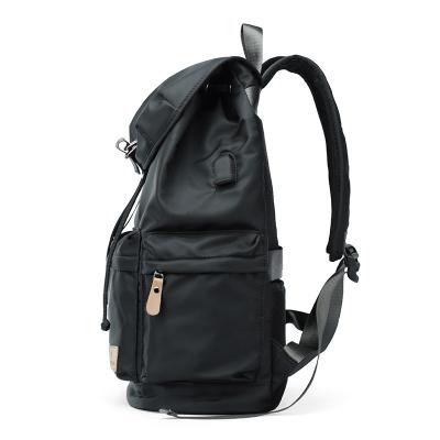 China Waterproof Zipper Black Backpack With USB Function Direct Selling Left Charging Anti-theft Backpack for sale