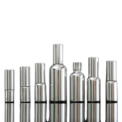 China Cosmetic Silver Plated Pure Clear Cosmetic Packaging Bottle Hot Silver Spray Glass Bottle for sale