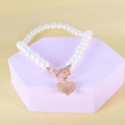 China Hiphop made necklace decorated with female temperament pearl relief square mark Ot buckle imitation necklace for sale