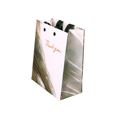 China Exquisite Customized Disposable Gift Bag Handle Paper Gift Packaging Bag Exquisite Paper Organizer With Custom Logo for sale