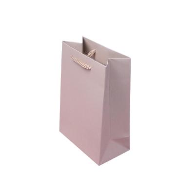 China Disposable Customized Pink Paper Gift Bag Handle Paper Gift Packaging Bag Organizer with Custom Logo for sale