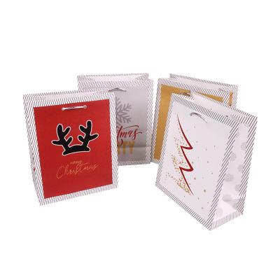 China Christmas Disposable Multicolor Paper Gift Bag Silver Rope Handle Paper Gift Wrapping Bag Organizer With Custom Logo for sale