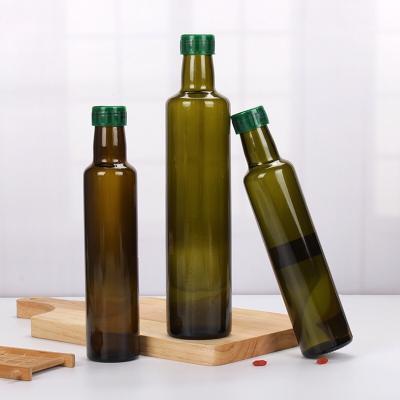 China Eco-friendly Recyclable In Brown Cylinder Shape Glass Stock Empty Dark Green Cooking Oil Bottle 500ml 750ml Thicken Glass Olive Oil Bottle for sale