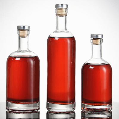 China Beverage in stock thicken cylinder wine container whiskey red wine vodka transparent empty glass drinking refillable bottle for sale