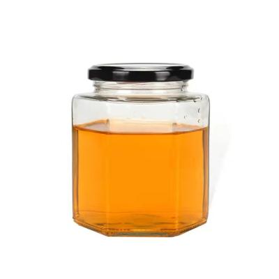 China Wholesale High Quality Food Factory Cheap Price Hexagonal Shaped Glass Honey Bottle 280ml 380ml 730ml Jar With Metal Lid for sale