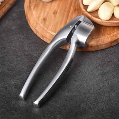 China Multi Functional Affordable Price Sustainable Handheld Manual Kitchen Garlic Crusher Plastic Press for sale