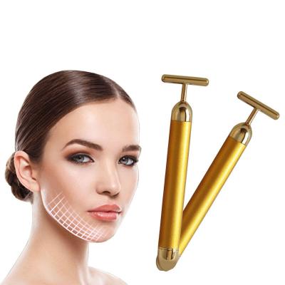 China Skin Tightening Vibrating Roller Gold Massager Skin Beauty Face Roller for sale