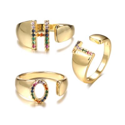 China Trendy Fashion Initlia Rings Simple Gold Plated Stainless Steel Rainbow Crystal Open Name Letter Ring for sale