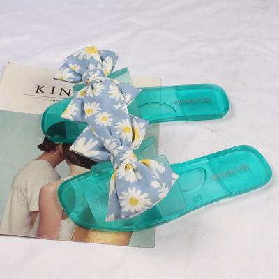 China CUSHIONING New Slippers Fashion Transparent Daily Bow Daisy Beach Flip Flop Jelly Casual Outdoor Slippers for sale