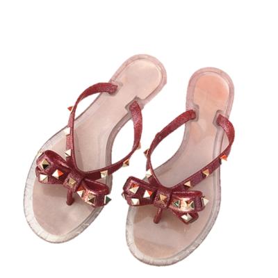 China CUSHIONING New Beach Garden Pin Bow Jelly Crystal Riveted Flip Flops For Ladies for sale