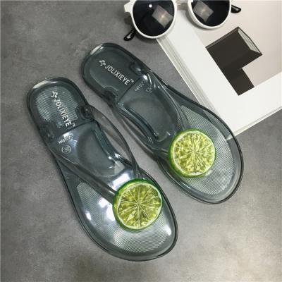 China CUSHIONING new summer jelly flip flops fruit lemon flip flops transparent beach shoes freeze women slippers for sale