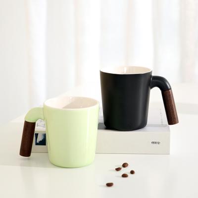 China Stocked Wholesale Custom Logo Matte Four Color Gifts Mug Porcelain Coffee Mug With Wooden Handle Sublimation CeramicTravel Mug Student for sale