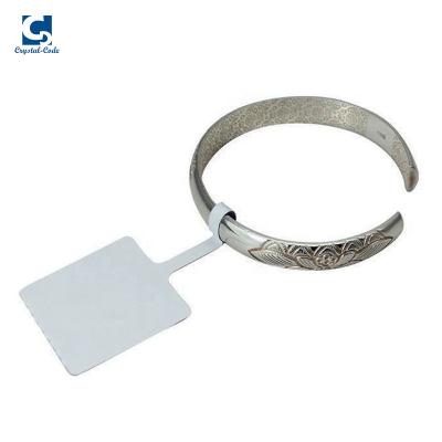 China Waterproof Custom Logo Paper Tamper Evident Tags Roll Label Triangle UHF Transparent Jewelry Sticker for sale