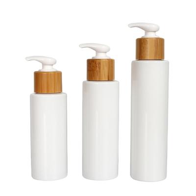 China Sustainable 100/120/150ML Cylinder Dispenser Kitchen And Bathroom Bamboo Pump White Plastic Bottles For Liquid Soap for sale