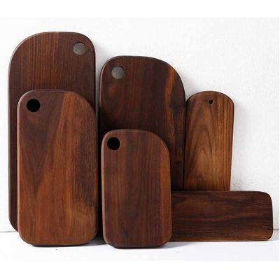 China Sustainable Durable Whole Wooden Kitchen Cutting Board Black Walnut Set For Smart Chesse Fruit Bread Cutting Board for sale