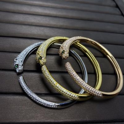 China Wholesale Casual/Sporty Flat 18KGold Silver Leopard Zircon Wholesale Casual/Sporty Stainless Steel Men Women Couples Bracelet Trendy Animal Cuff Designer Bracelet for sale