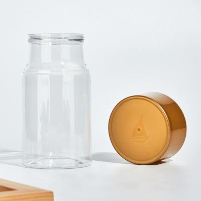 China 700ML High Cover Food Jar With Screw Lids Gold Plastic Food Container For Almond And Cookies Packaging for sale