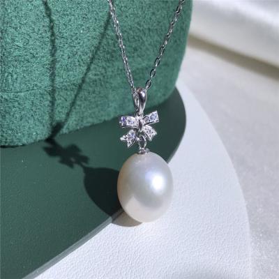 China 925 Sterling Silver Fashionable Simple Butterfly Bowknot Pearl Necklace 12-13MM Natural Pearl Chain Pendant Necklace Beautiful for sale