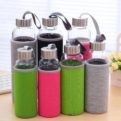 China Sustainable High Borosilicate Glass BPA Free Water Bottles With Stainless Steel Lid And Fabric Sleeve for sale