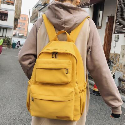 China Customized Raincoats Waterproof Nylon Backpack Women's Multi-pocket Travel Backpack Pure Color Youth Backpack for sale