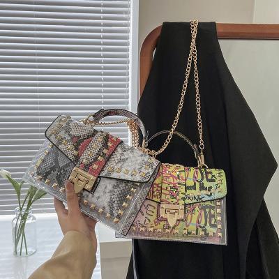 China Fashion \ comfortable graffiti \ goods 2021 color printed shoulder luxury brand handbags rivet design fashion trends ladies handbags ladies handbags for sale