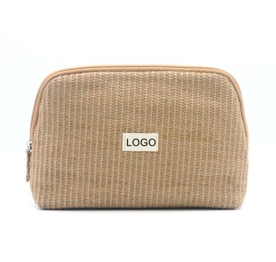 China Normcore / Full Eco-friendly Minimalist Straw Cosmetic Bag Popular Shell Shape Zipper Natural Closure Straw Makeup Bag for sale