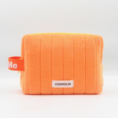 China Fashion 2022 Newest Arrivals Fluffy Pouch Quilited Orange Velvet rPET Flannel Handle Eco-friendly Makeup Bag Cosmetic Bag for sale