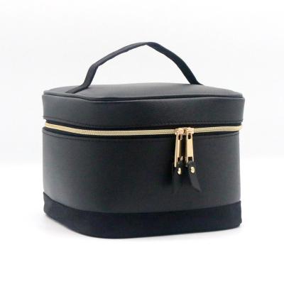 China Classic Elegant Water-based Leather Makeup Bag Portable Medium Size PU Handled Black Waterproof Cosmetic Bag for sale