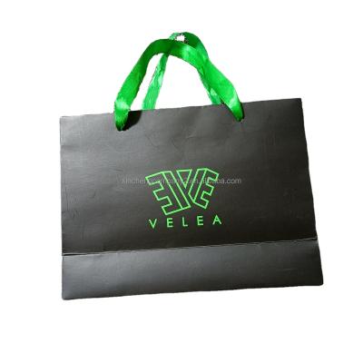 China Recycled Materials Customized Logo Hot Stamping Printing Pink Gift Shopping Paper Bag for sale