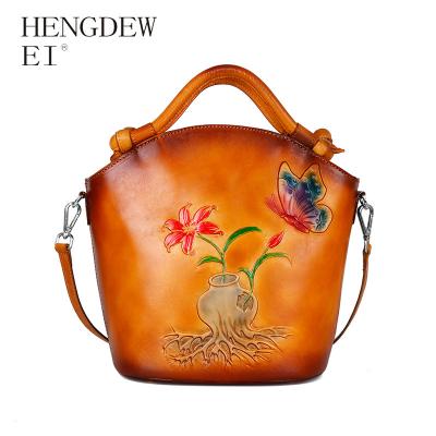 China Daily Used Chinese Windproof Layer Vintage Embossed Cowhide Color One Shoulder Diagonal Shoulder Span Water Bucket Portable Hand-Wiping Bag for sale