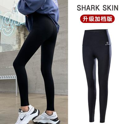 China Breathable Spring And Autumn High Waist Letter Shark Skin Leggings Sports Women Yoga Pants Slim Pants Nine Point Gym Fitness Liquid Pants for sale