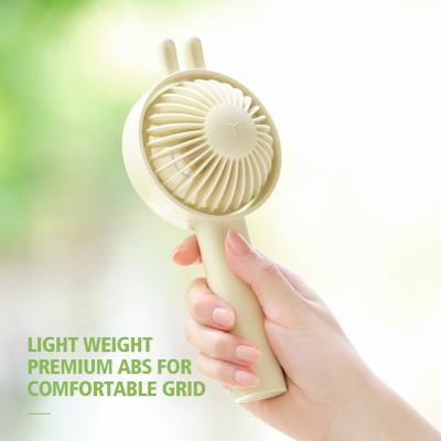 China Adjustable Portable Mute Heavy Wind Rechargeable Cute Rabbit Ear Wind Sense Fan Mini Handheld Cooling Fan Outdoor For Travel Free Sample for sale