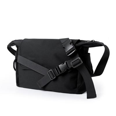 China Lightweight Multi Pocket Black Unisex Oxford Cross - Body Bag 2022 Fashion Shoulder Bag Waterproof Button Decoration Sling Bag For Man for sale