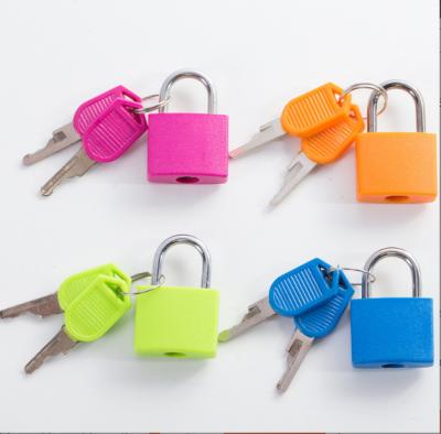 China Brass 23mm 38mm 35mm 43mm Waterproof plastic coated small brass padlock Gift padlock Luggage locks for sale