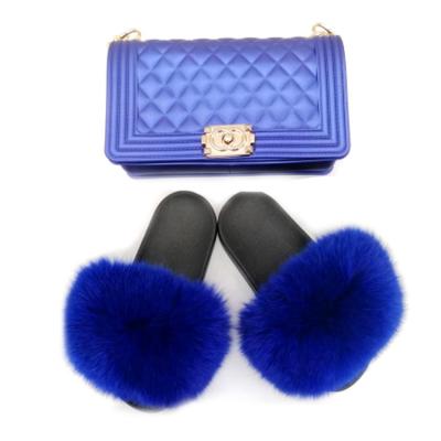 China Damping Factory Direct Wholesale Raccoon Fur Slippers Winter Bow Slippers Fox Fur Slippers For Women for sale