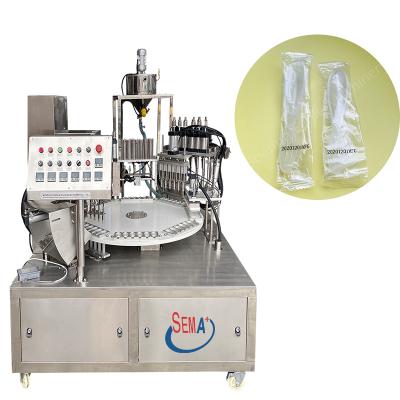 China 10g Food Honey Packing Rotary Type 6 Nozzles Plastic Honey Spoon Filling And Sealing Machine for sale