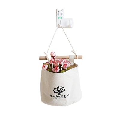 China Modern Door Hanging Flower Sundries Organizer Cotton Linen Fabric Storage Bags Basket for sale