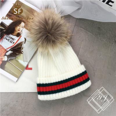 China COMMON fashion unisex winter custom pom warm fluffy stripe knitted real raccoon fur hats for baby for sale