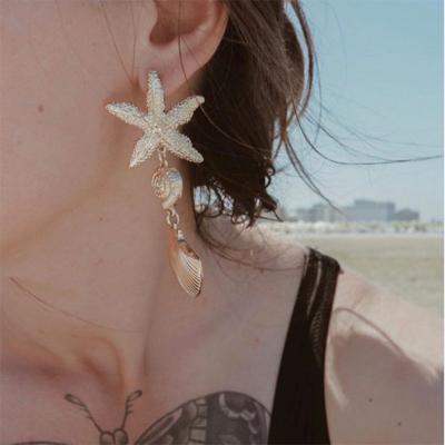 China Fashion Summer Vacation Beach Starfish Earrings Women Asymmetric Shell Starfish Pendant Earrings Metal Jewelry for sale