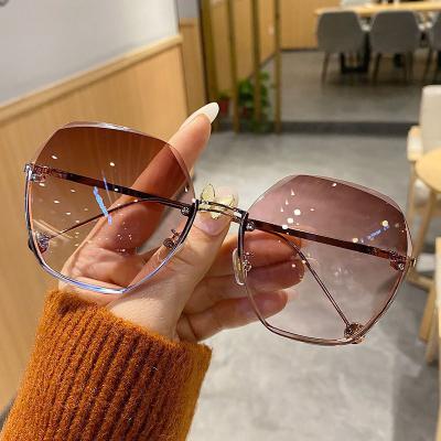 China Fashion new high quality frameless cut edge sunglasses women's red net temperament sunglasses shape glass UV protection for sale