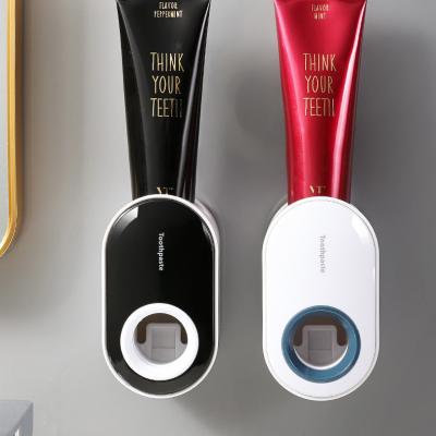 China Manufacturer Stocked Direct Supply Wall Mounted Bathing Room Plastic Toothpaste Holder Squeezer Dispenser for sale