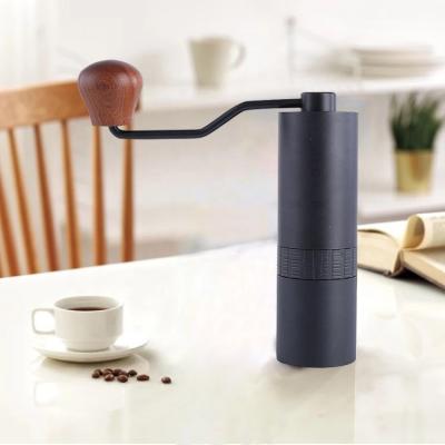 China Who respects the environment. Easy Camping Handheld Eco-Friendly Wooden Handle Mini Portable Conical Metal Flat Grind Manual Coffee Grinder Black for sale