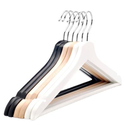 China Fashion Custom Velvet Wardrobe Brand Wooden Hanger With Velvet Assembled Shoulder And Bar for sale